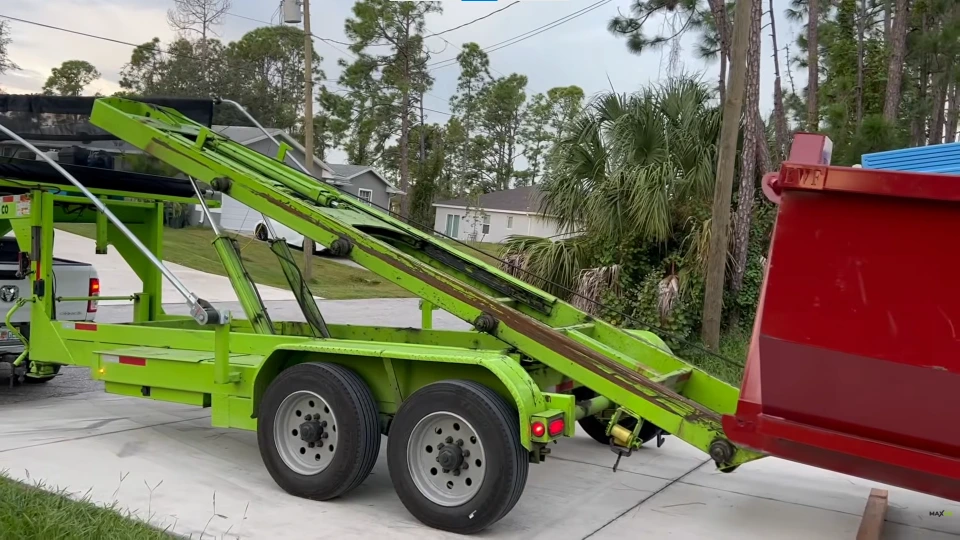 Empty roll-off dumpster positioned for loading at a jobsite