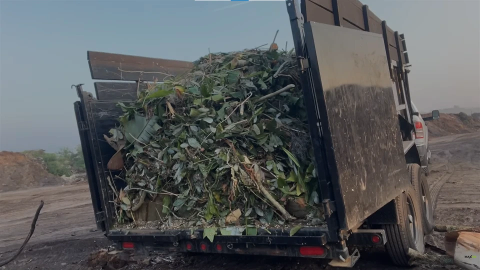 Dumpster being offloaded for delivery in West Louisville KY